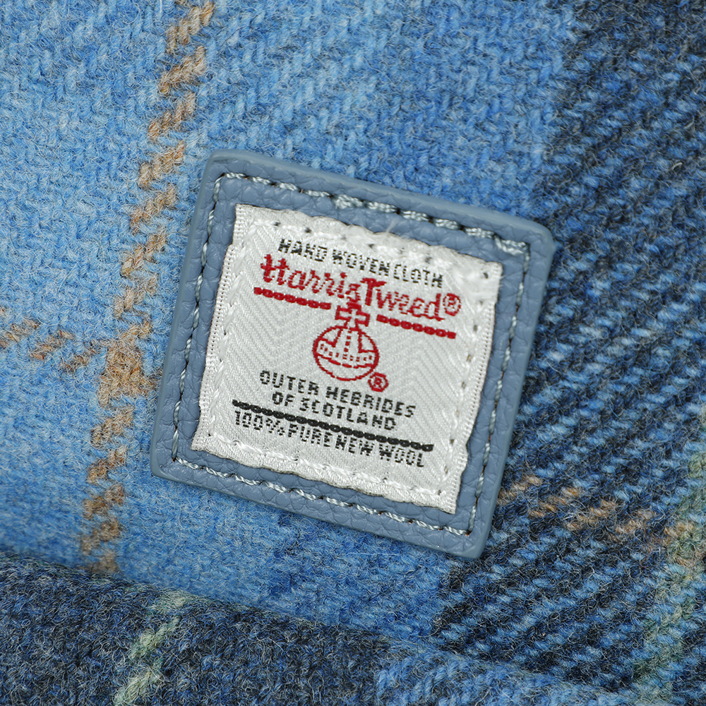 Strathurie Fashion Accessory Wholesaler Glasgow a label on a blue plaid fabric